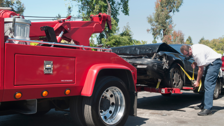 towing a black damaged car